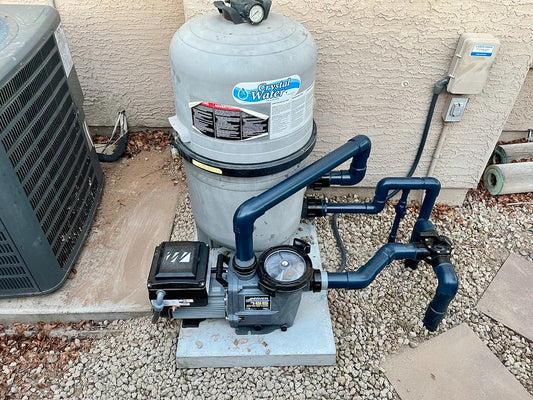 Variable speed pool pump installed with PVC plumbing on equipment pad