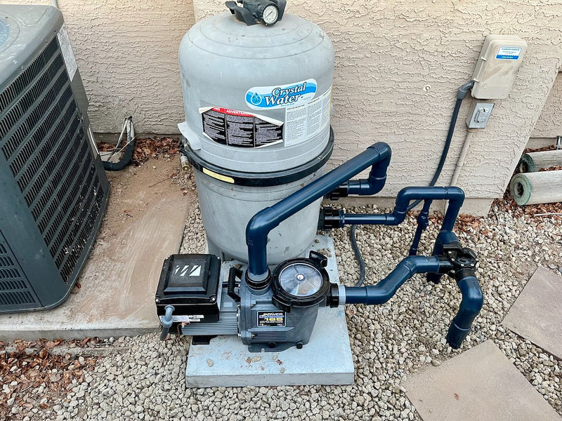 Variable speed pool pump installed with PVC plumbing on equipment pad